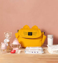 Sleek and compact yellow stroller hanging baby bag with a modern design, featuring easy-access pockets and secure stroller attachment for stylish, hands-free parenting.
