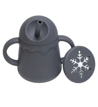 Two-in-one silicone cup demonstrating sipping and snacking features