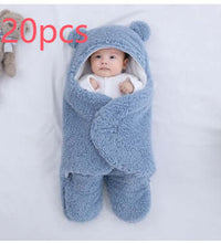 Baby wrapped in a cozy blue sleeping bag with bear ears, perfect for warmth and comfort during sleep.