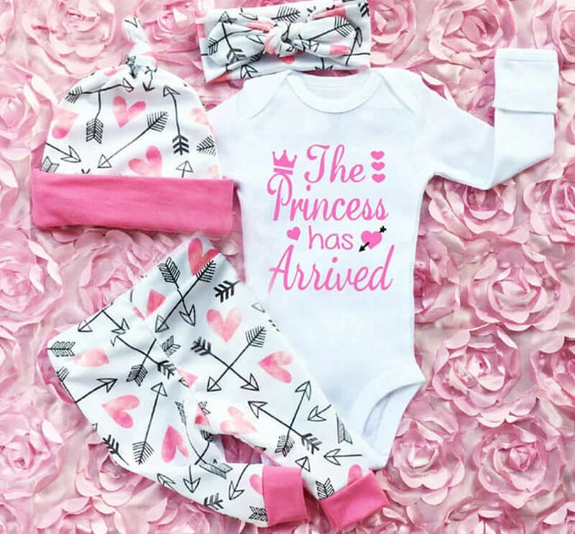 Adorable 4-piece baby girl outfit set with romper, bodysuit, pants and dress in soft pastel colors