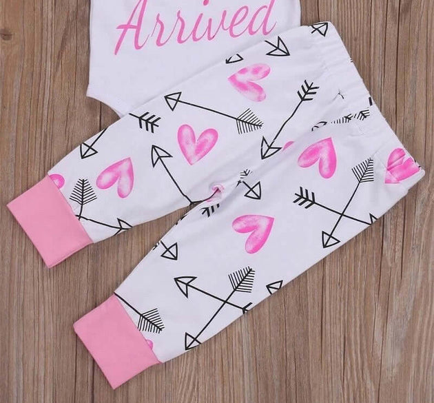 Adorable 4-piece baby girl outfit set with romper, bodysuit, pants and dress in soft pastel colors
